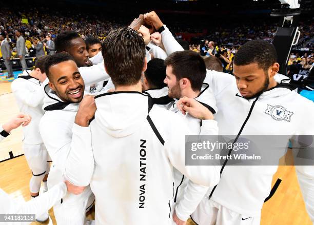 Phil Booth and Omari Spellman of the Villanova Wildcats huddle with teammates before the 2018 NCAA Photos via Getty Images Men's Final Four National...