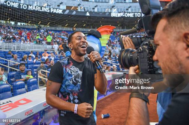 Rapper Ludacris sings "Lets Play Ball" before the game between the Miami Marlins and the Boston Red Sox at Marlins Park on April 2, 2018 in Miami,...