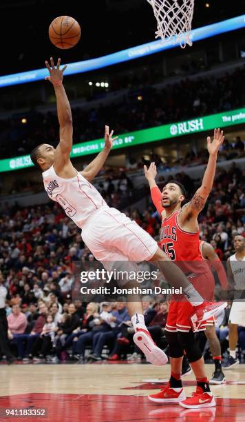 Ramon Sessions of the Washington Wizards puts up a shot over Denzel Valentine of the Chicago Bulls at the United Center on April 1, 2018 in Chicago,...