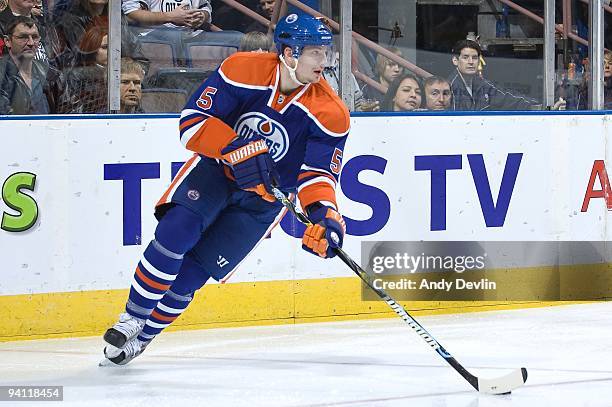 Ladislav Smid of the Edmonton Oilers breaks out with the puck against the San Jose Sharks at Rexall Place on November 27, 2009 in Edmonton, Alberta,...