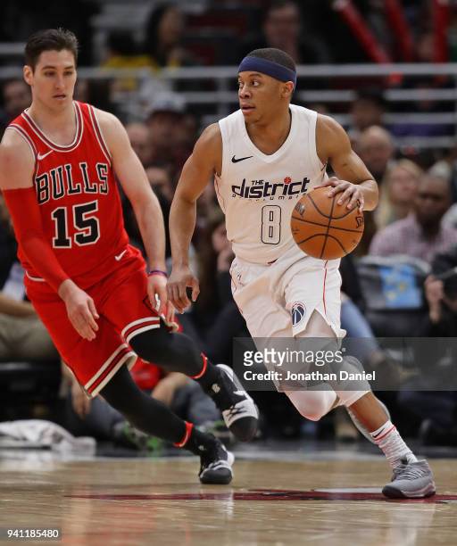 Tim Frazier of the Washington Wizards drives around Ryan Arcidiacono of the Chicago Bulls at the United Center on April 1, 2018 in Chicago, Illinois....