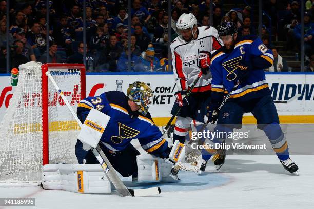 Jake Allen and Alex Pietrangelo of the St. Louis Blues defend the goal against Alex Ovechkin of the Washington Capitals at Scottrade Center on April...