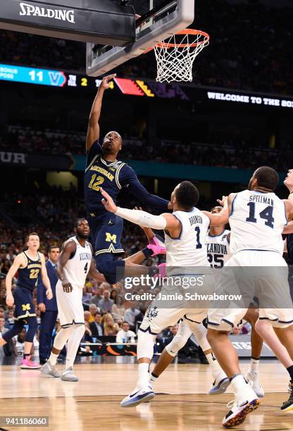 Muhammad-Ali Abdur-Rahkman of the Michigan Wolverines drives to the basket against the Villanova Wildcats during the first half of the 2018 NCAA...