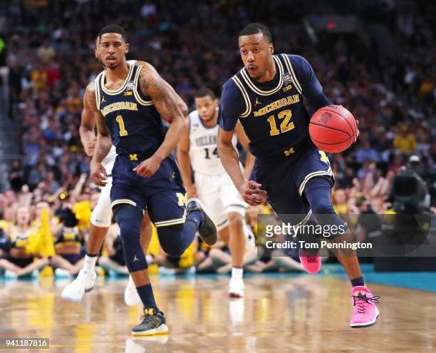 Muhammad-Ali Abdur-Rahkman of the Michigan Wolverines controls ball against the Villanova Wildcats in the first half during the 2018 NCAA Men's Final...