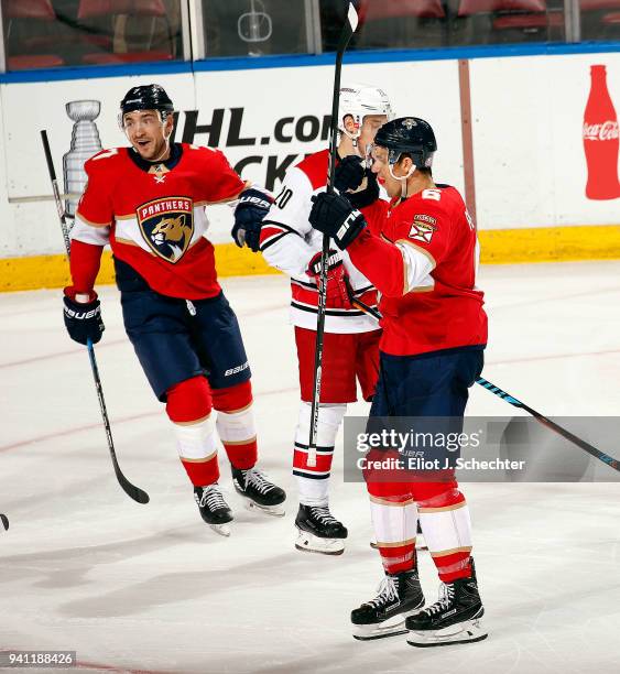 Alex Petrovic of the Florida Panthers celebrates his game winning goal with teammates against the Carolina Hurricanes at the BB&T Center on April 2,...