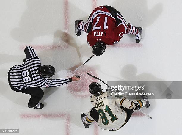 Michael Latta of the Guelph Storm gets set to take a faceoff against Nazem Kadri of the London Knights in a game on December 4, 2009 at the John...