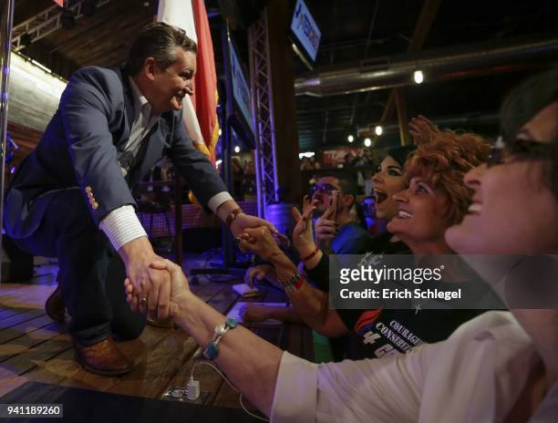 Sen. Ted Cruz shakes hands with supporters during a rally to launch his re-election campaign at the Redneck Country Club on April 2, 2018 in...