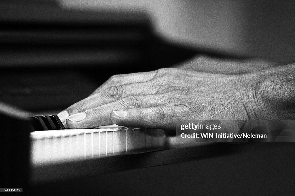 Close-up of a man's hand playing a piano, Santiago, Chile