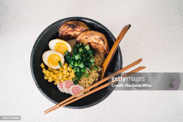 a delicious bowl of ramen being prepared in the kitchen - ramen noodles stock pictures, royalty-free photos & images