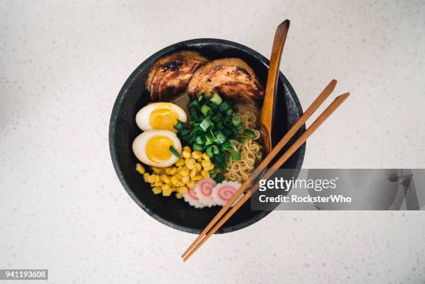a delicious bowl of ramen being prepared in the kitchen - char siu pork stock pictures, royalty-free photos & images