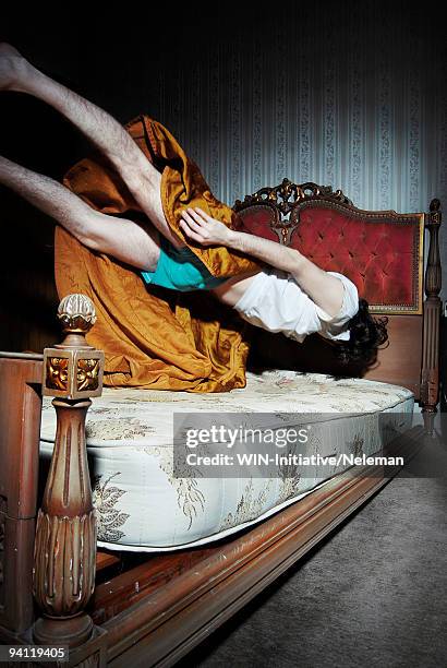 man levitating above a bed, buenos aires, argentina - prono foto e immagini stock