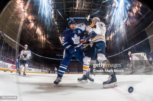 Tyler Bozak of the Toronto Maple Leafs skates against Marco Scandella of the Buffalo Sabres during the third period at the Air Canada Centre on April...