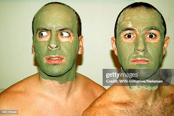 two men with mud masks, santiago, chile - funny face mask stock-fotos und bilder