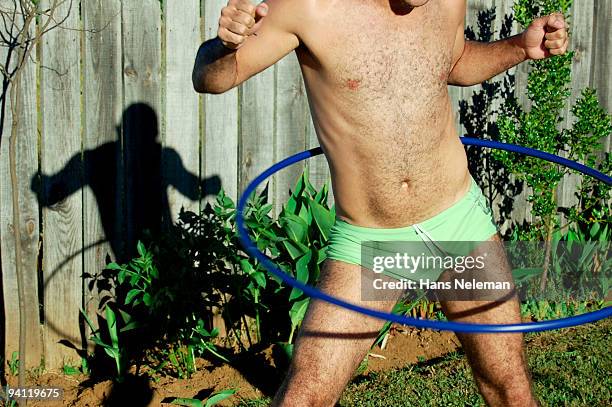 man playing with a plastic hoop, gorbea, chile - gymnastikreifen stock-fotos und bilder