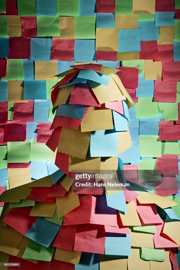 Businessman wrapped in sticky notes, Mexico City, Mexico