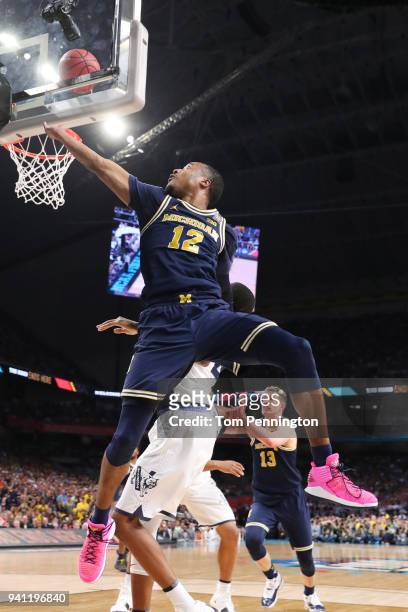 Muhammad-Ali Abdur-Rahkman of the Michigan Wolverines attempts a lay up against the Villanova Wildcats in the first half during the 2018 NCAA Men's...