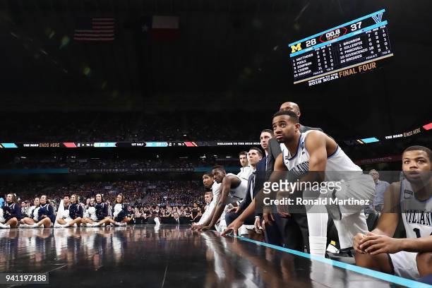 Phil Booth of the Villanova Wildcats looks on with teammates in the first half against the Michigan Wolverines during the 2018 NCAA Men's Final Four...