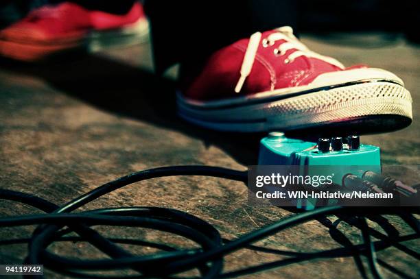 close-up of a person's foot on a music distortion effect paddle, buenos aires, argentina - unplugged fixed show stock pictures, royalty-free photos & images