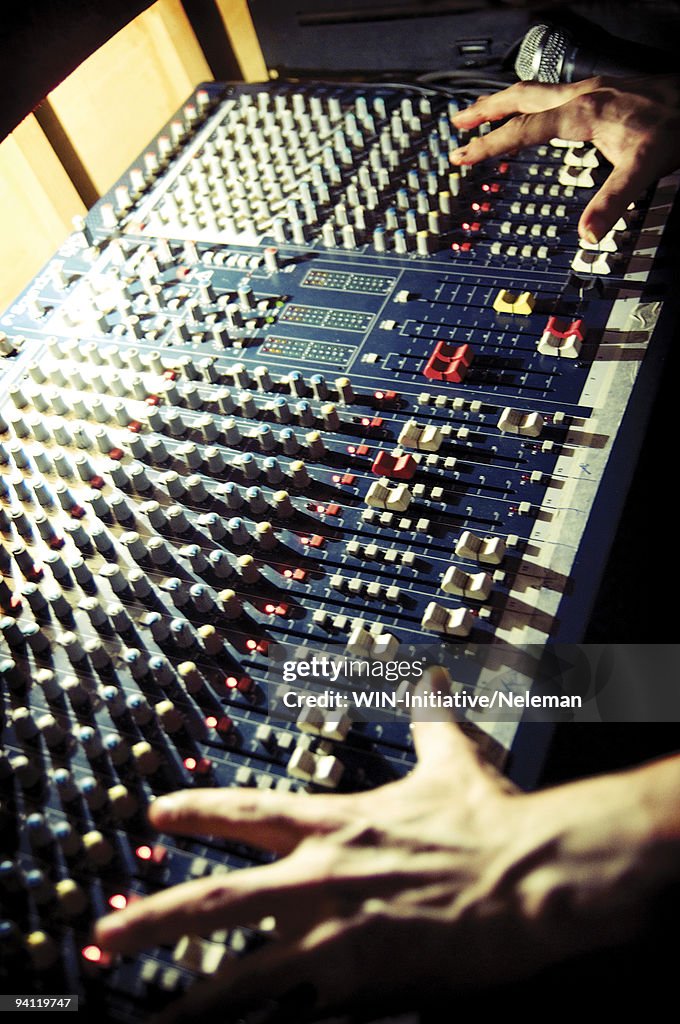 Person's hand operating a sound mixer, Buenos Aires, Argentina