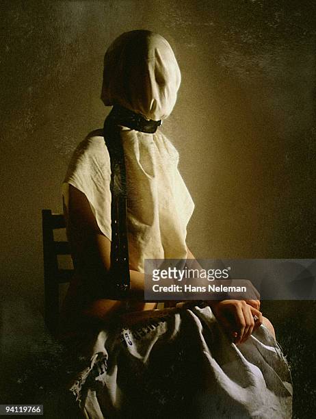 woman sitting on a chair with obscured face, lugansk, ukraine - tangled stock-fotos und bilder