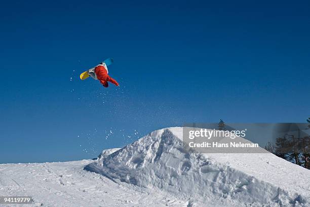 low angle view of a man snowboarding, ruka, finland - finland spring stock pictures, royalty-free photos & images