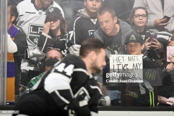 Young fan holds a sign rooting on Nate Thompson of the Los Angeles Kings before a game against the Colorado Avalanche at STAPLES Center on April 2,...