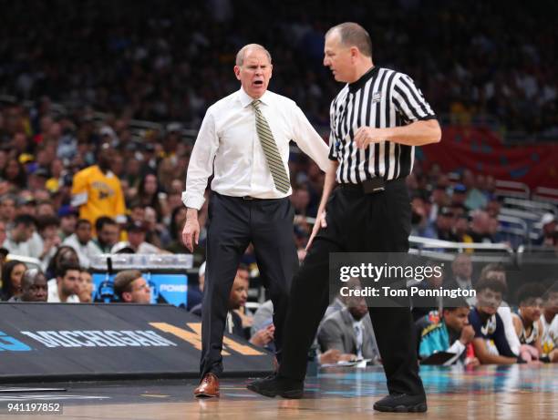 Head coach John Beilein of the Michigan Wolverines complains to the referee against the Villanova Wildcats in the second half during the 2018 NCAA...