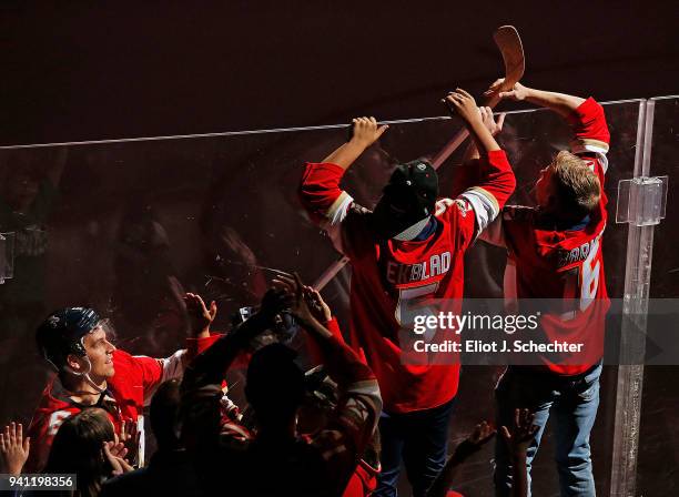 Alex Petrovic of the Florida Panthers celebrates with fans their 3-2 win over the Carolina Hurricanes at the BB&T Center on April 2, 2018 in Sunrise,...