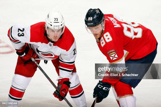 Brock McGinn of the Carolina Hurricanes gets set for a face off against his brother Jamie McGinn of the Florida Panthers at the BB&T Center on April...