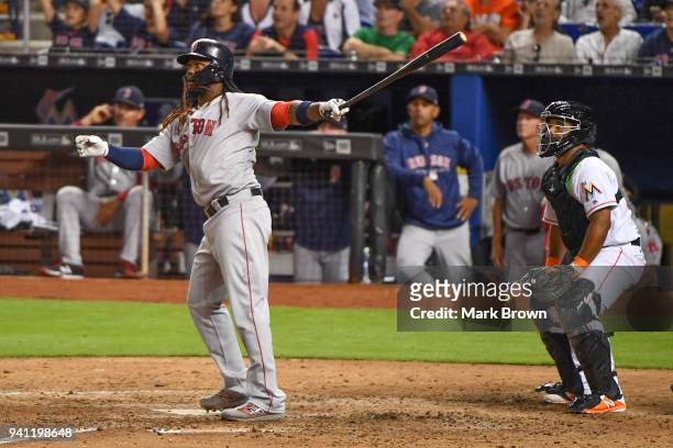 Hanley Ramirez of the Boston Red Sox hits a home run in the fifth inning during the game against the Miami Marlins at Marlins Park on April 2, 2018...