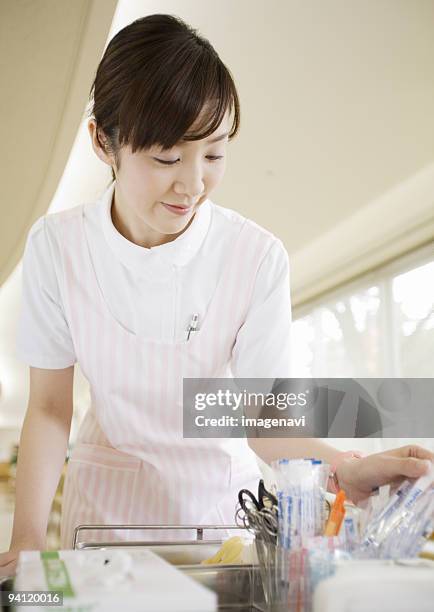 a nurse - woman smiling facing down stock pictures, royalty-free photos & images