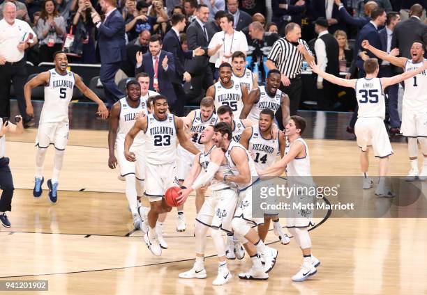 Donte DiVincenzo of the Villanova Wildcats is met by teammates after the 2018 NCAA Photos via Getty Images Men's Final Four National Championship...