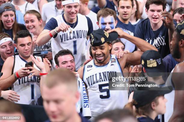Phil Booth of the Villanova Wildcats celebrates with teammates after defeating the Michigan Wolverines during the 2018 NCAA Men's Final Four National...