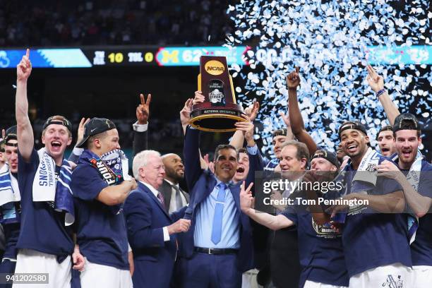 Head coach Jay Wright of the Villanova Wildcats raises the trophy with his team after defeating the Michigan Wolverines during the 2018 NCAA Men's...