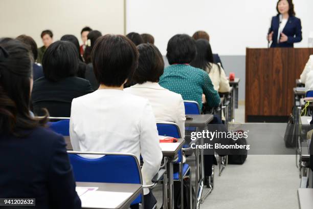 Students attend the inaugural class by Seiko Noda, Japan's internal affairs and communications minister, right, at her school for female politicians...