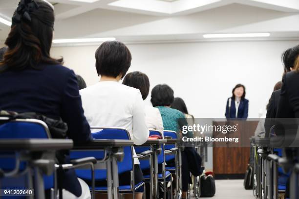 Students attend the inaugural class by Seiko Noda, Japan's internal affairs and communications minister, right, at her school for female politicians...