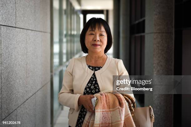 Kiyomi Sumida, assemblywoman for Hida city in Gifu prefecture, poses for a photograph before attending the inaugural class at Internal Affairs and...