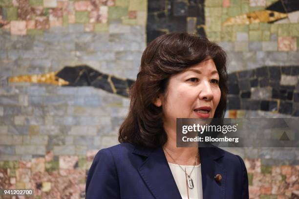 Seiko Noda, Japan's internal affairs and communications minister, speaks to members of the media at the opening day of her school for female...