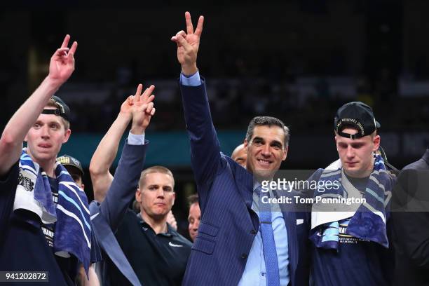 Head coach Jay Wright of the Villanova Wildcats celebrates with his team after defeating the Michigan Wolverines during the 2018 NCAA Men's Final...