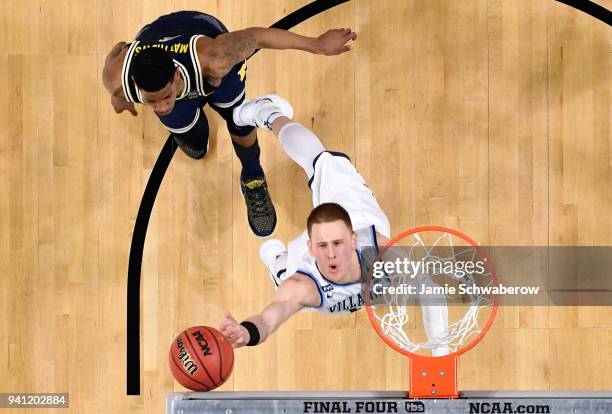 Donte DiVincenzo of the Villanova Wildcats drives to the basket against the Michigan Wolverines during the second half of the 2018 NCAA Photos via...