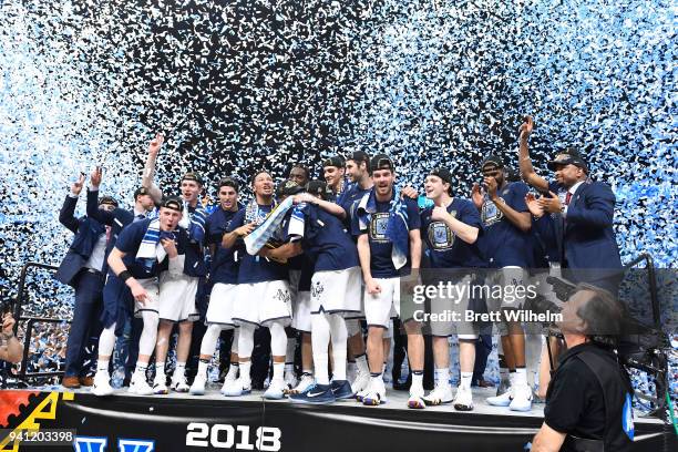 The Villanova Wildcats celebtrate on stage after the 2018 NCAA Photos via Getty Images Men's Final Four National Championship game against the...