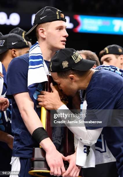 Donte DiVincenzo and Jalen Brunson of the Villanova Wildcats celebrate with the trophy after the 2018 NCAA Photos via Getty Images Men's Final Four...