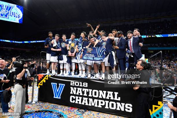 The Villanova Wildcats celebrate with the trophy after the 2018 NCAA Photos via Getty Images Men's Final Four National Championship game against the...