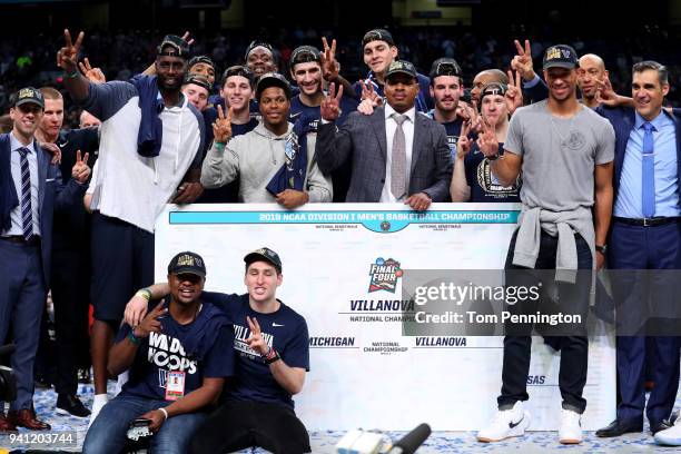 Former Villanova Wildcats Tim Thomas, Kyle Lowry and Randy Foye celebrate with the team after defeating the Michigan Wolverines during the 2018 NCAA...