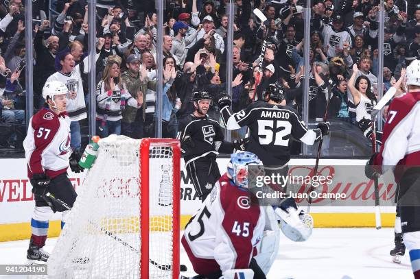 Michael Amadio and Torrey Mitchell of the Los Angeles Kings celebrate after scoring a goal against the Colorado Avalanche at STAPLES Center on April...