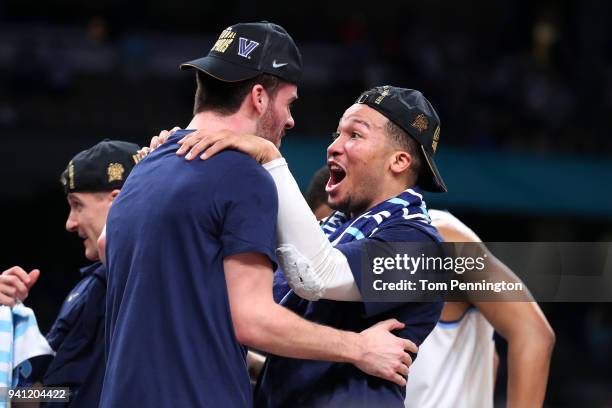 Tom Leibig and Jalen Brunson of the Villanova Wildcats celebrate after defeating the Michigan Wolverines during the 2018 NCAA Men's Final Four...