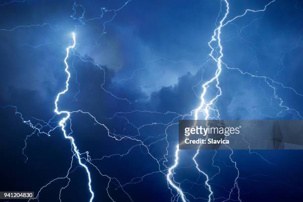 lightning during storm at night - storm season stock pictures, royalty-free photos & images