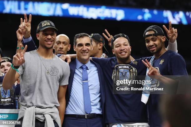 Former Villanova Wildcats player Josh Hart of the Los Angeles Lakers celebrates with head coach Jay Wright, Jalen Brunson and Phil Booth after...