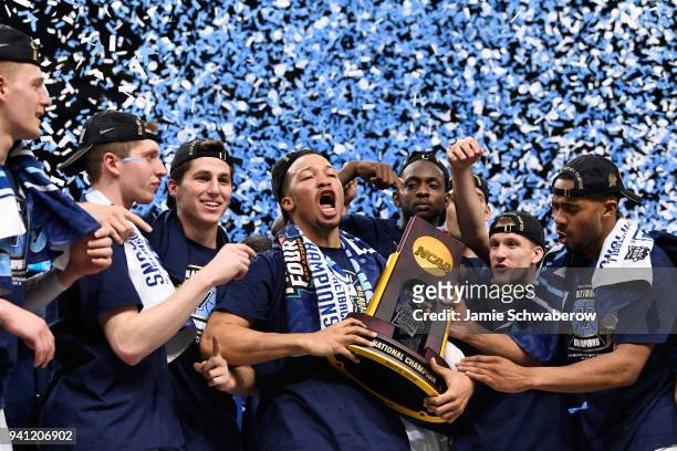 Jalen Brunson of the Villanova Wildcats celebrates with the trophy after the 2018 NCAA Photos via Getty Images Men's Final Four National Championship...
