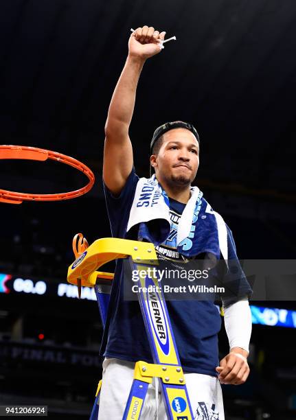 Jalen Brunson of the Villanova Wildcats holds a piece of the net after the 2018 NCAA Photos via Getty Images Men's Final Four National Championship...